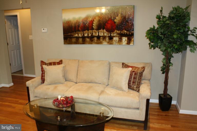 9314 Sudbury Road Silver Spring, MD 20901 - Photo 25 of 30 a bed room with furniture and a potted plant