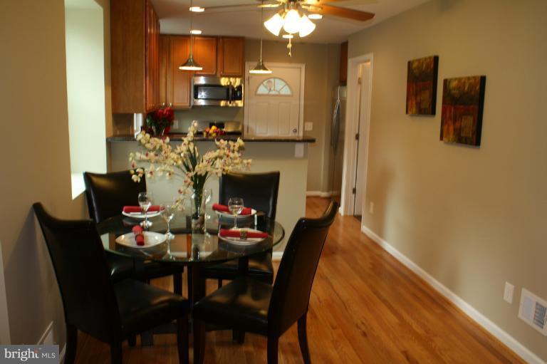 9314 Sudbury Road Silver Spring, MD 20901 - Photo 26 of 30 a view of a dining room with furniture and wooden floor