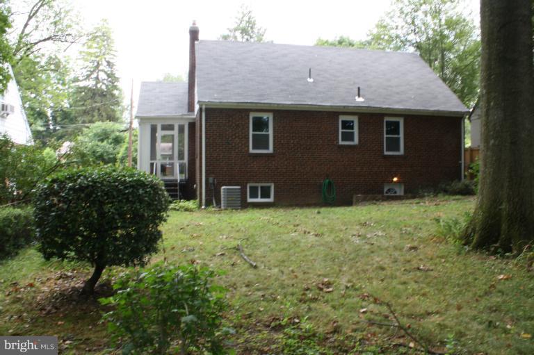 9314 Sudbury Road Silver Spring, MD 20901 - Photo 8 of 30 a view of a house with a yard and plants