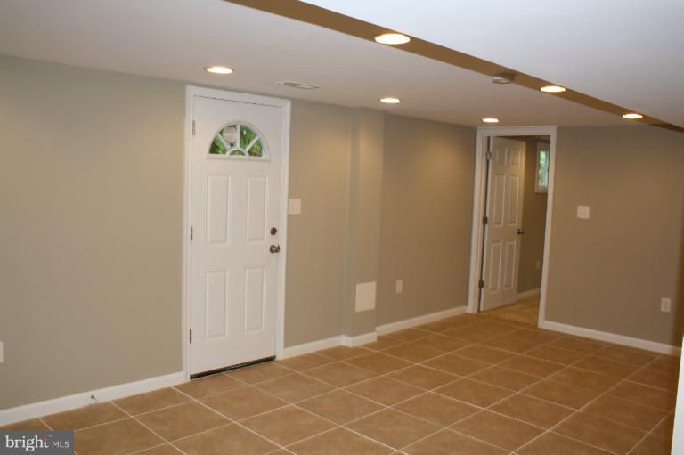 9314 Sudbury Road Silver Spring, MD 20901 - Photo 10 of 30 an empty room with windows and closet