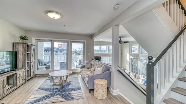 a bedroom with a bed ceiling fan and a window