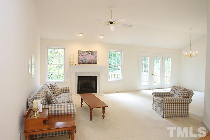 4404 Oakshyre Way Raleigh, NC 27616 - Photo 3 of 19 a living room with furniture and a fireplace