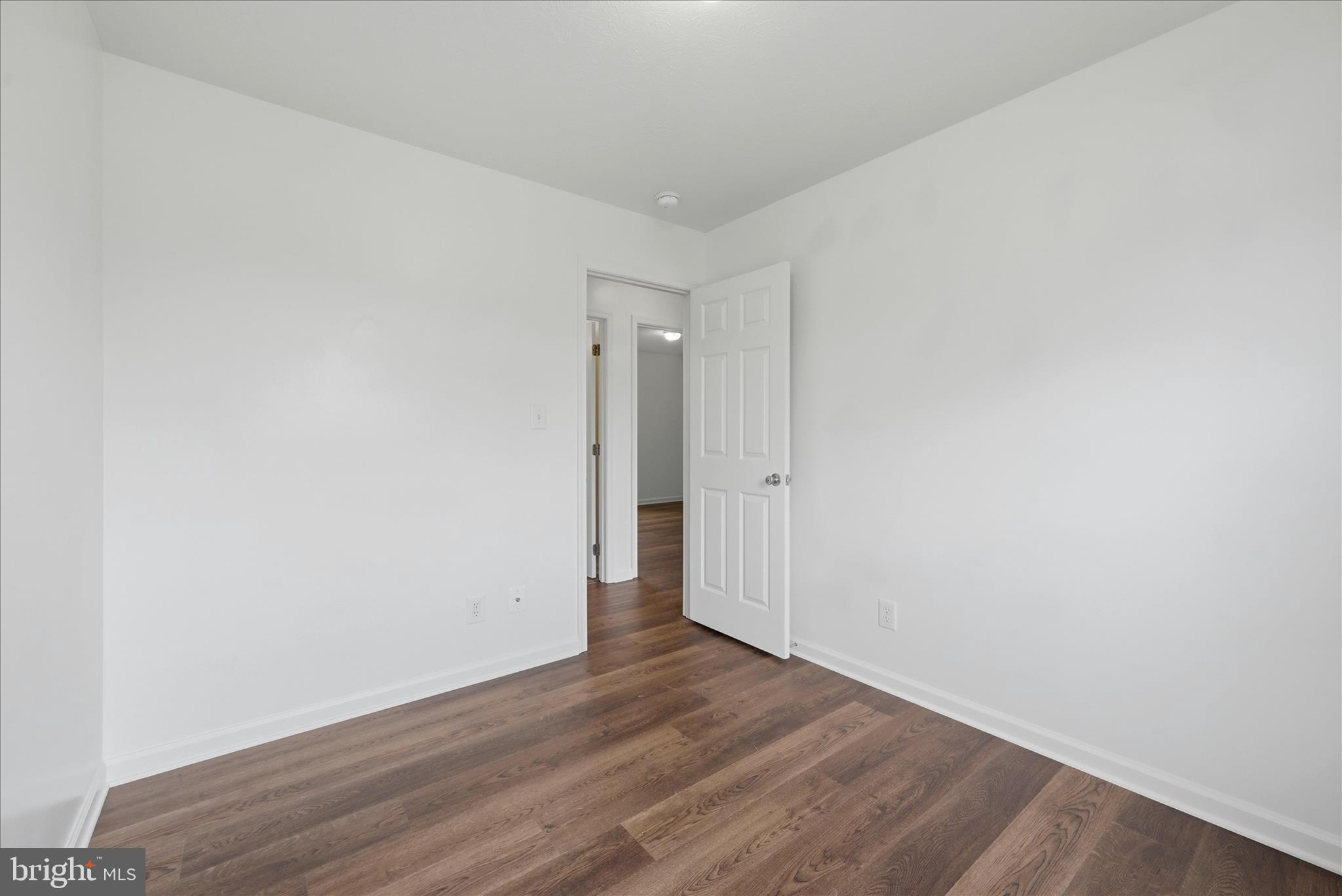 104 Basin Drive Inwood, WV 25428 - Photo 13 of 26 a view of an empty room with wooden floor and closet