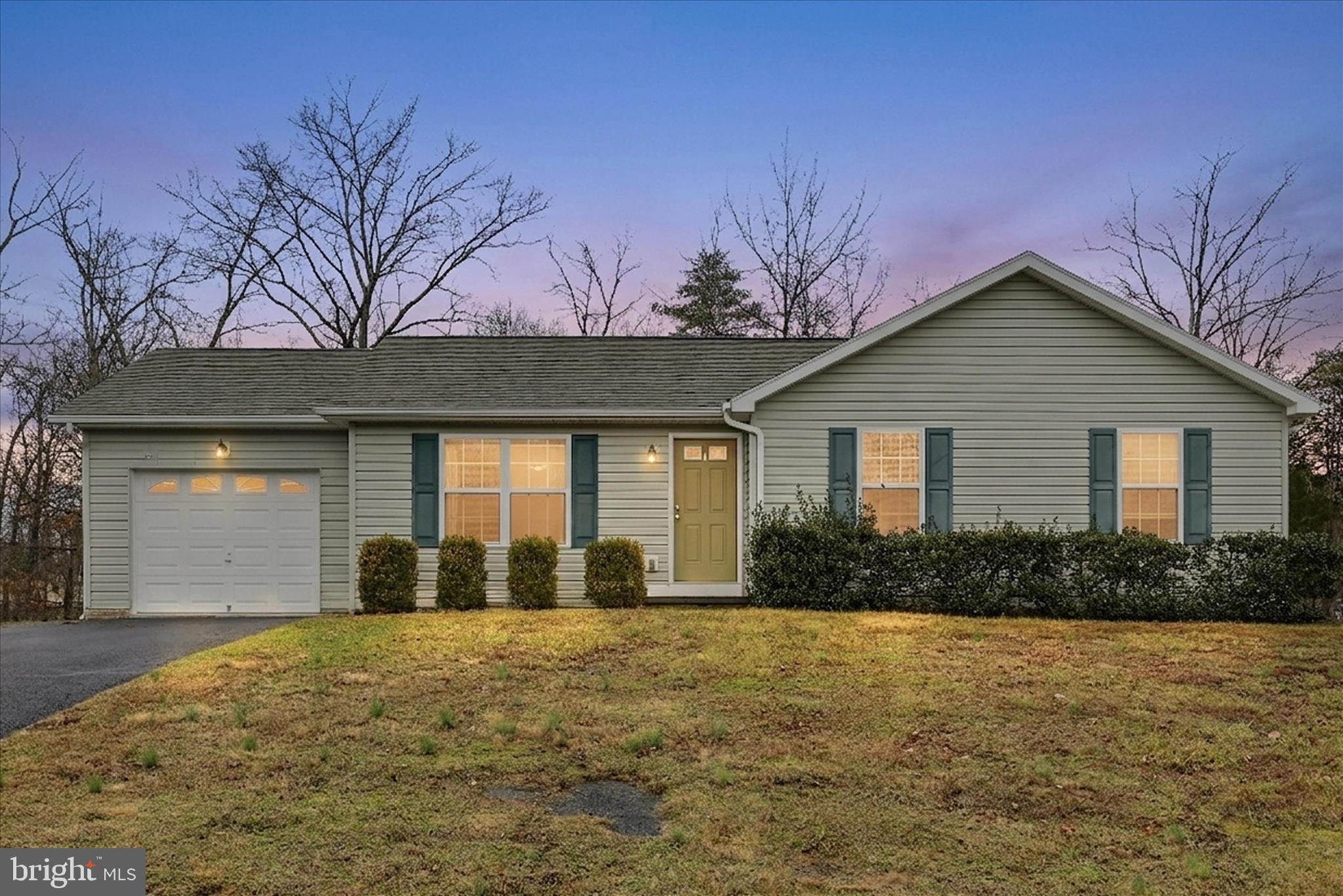 104 Basin Drive Inwood, WV 25428 - Photo 20 of 26 a front view of a house with garden