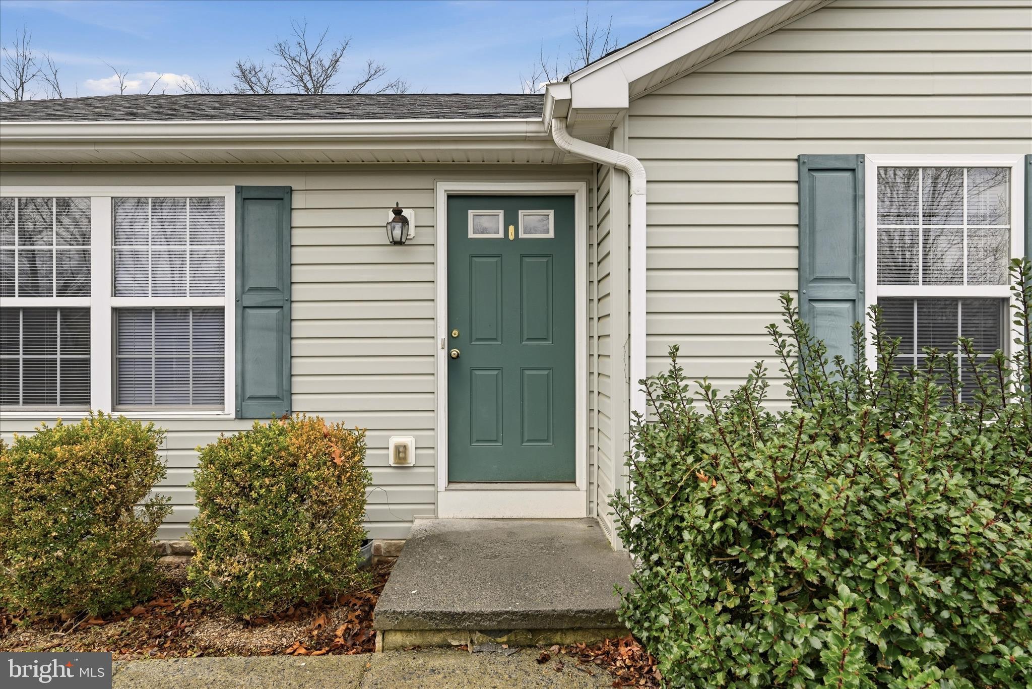 104 Basin Drive Inwood, WV 25428 - Photo 2 of 26 a view of a house with potted plants