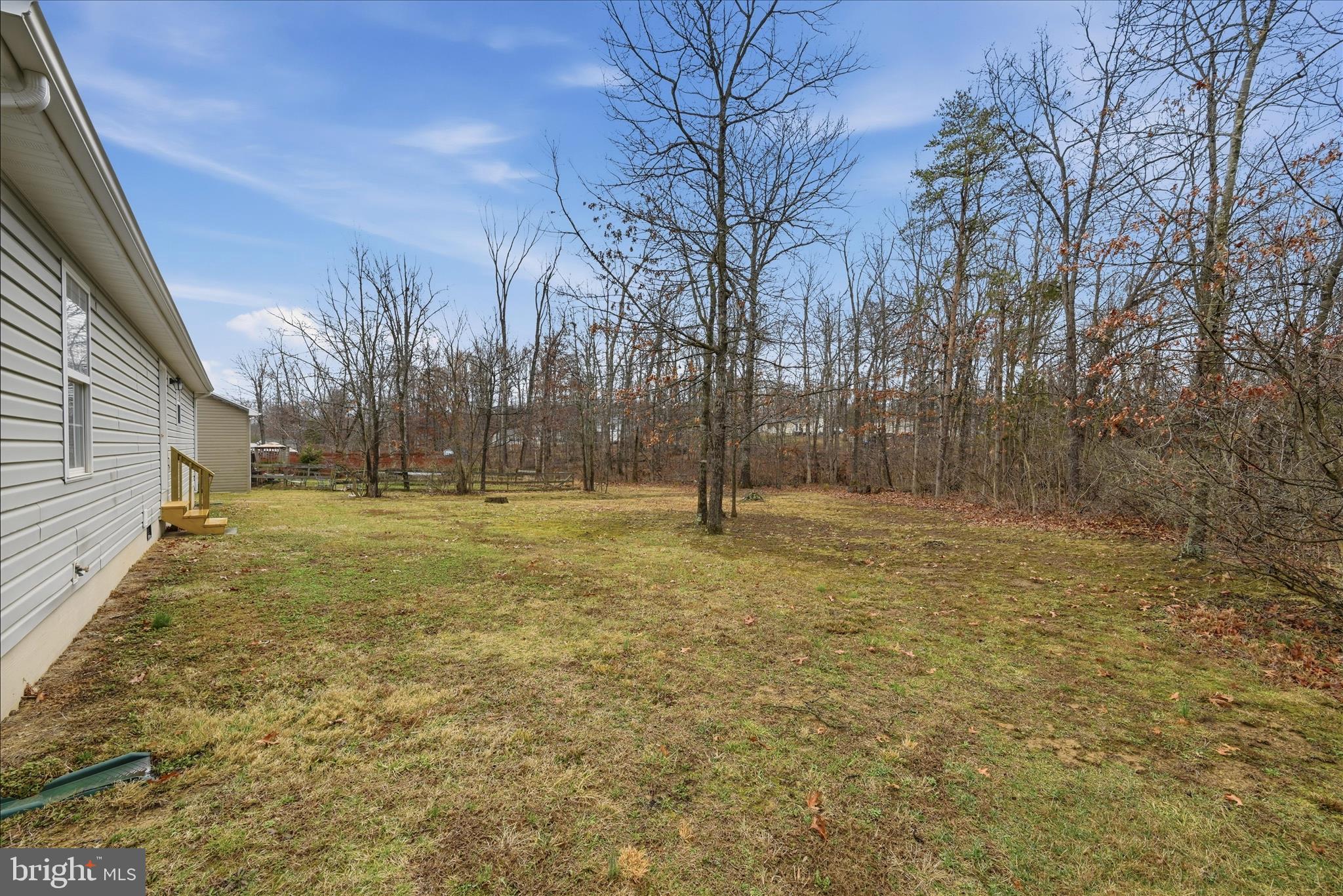 104 Basin Drive Inwood, WV 25428 - Photo 21 of 26 a view of a yard with trees