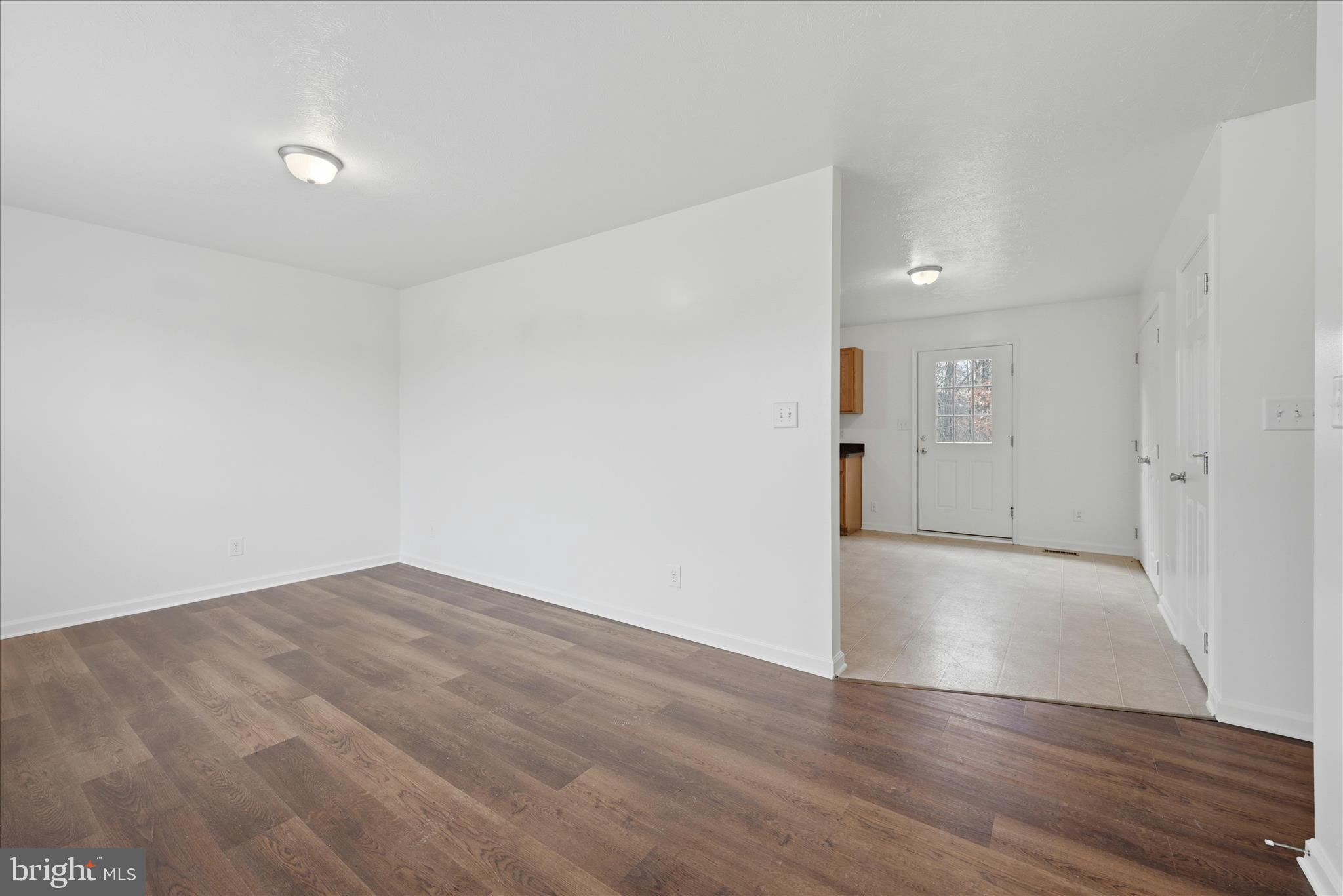 104 Basin Drive Inwood, WV 25428 - Photo 4 of 26 wooden floor in an empty room