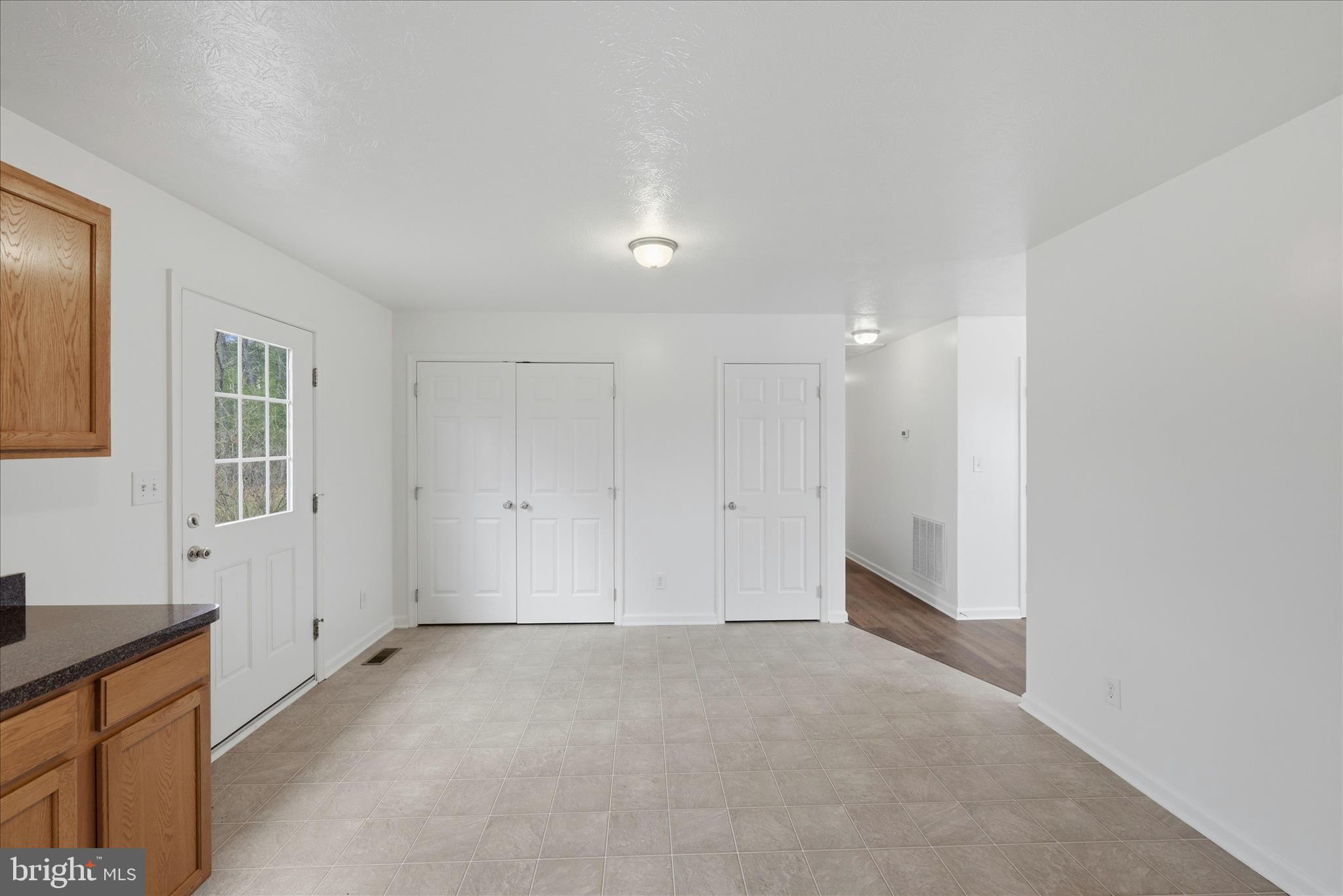 104 Basin Drive Inwood, WV 25428 - Photo 9 of 26 a view of an empty room with a window
