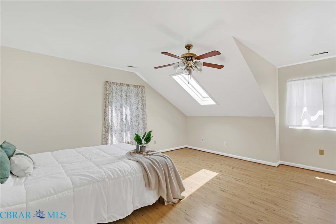 423 Kings Landing Road Onemo, VA 23130 - Photo 49 of 63 a bedroom with a bed and a chandelier