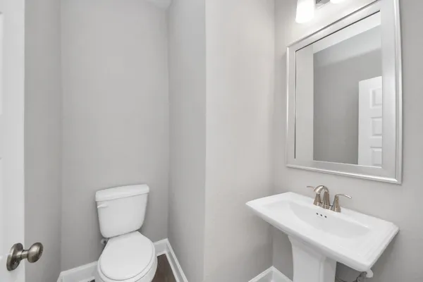 a kitchen with a sink a center island cabinets and a window