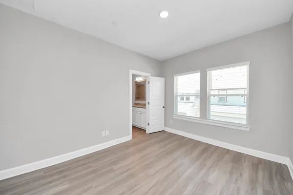 an empty room with wooden floor