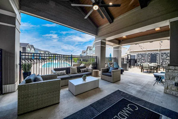 a view of a patio with swimming pool table and chairs
