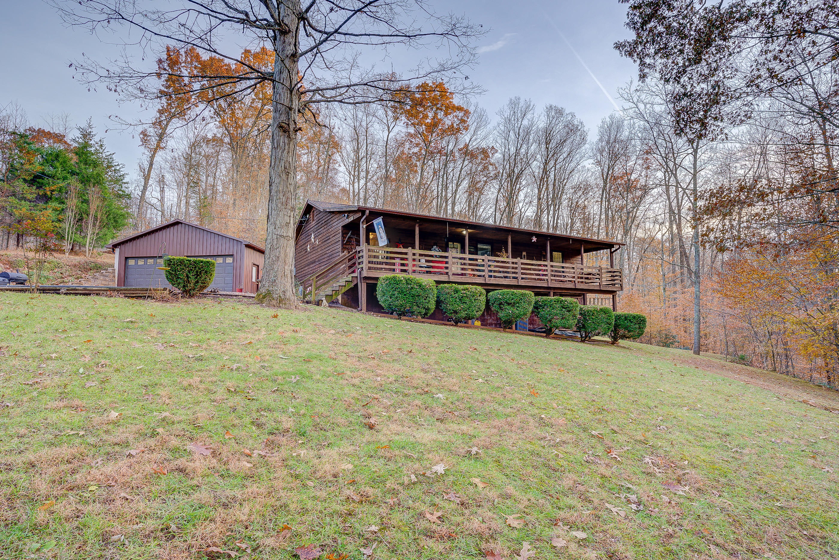 1037 Buck Mountain Road Goodview, VA 24095 - Photo 1 of 31 a front view of house with yard and trees