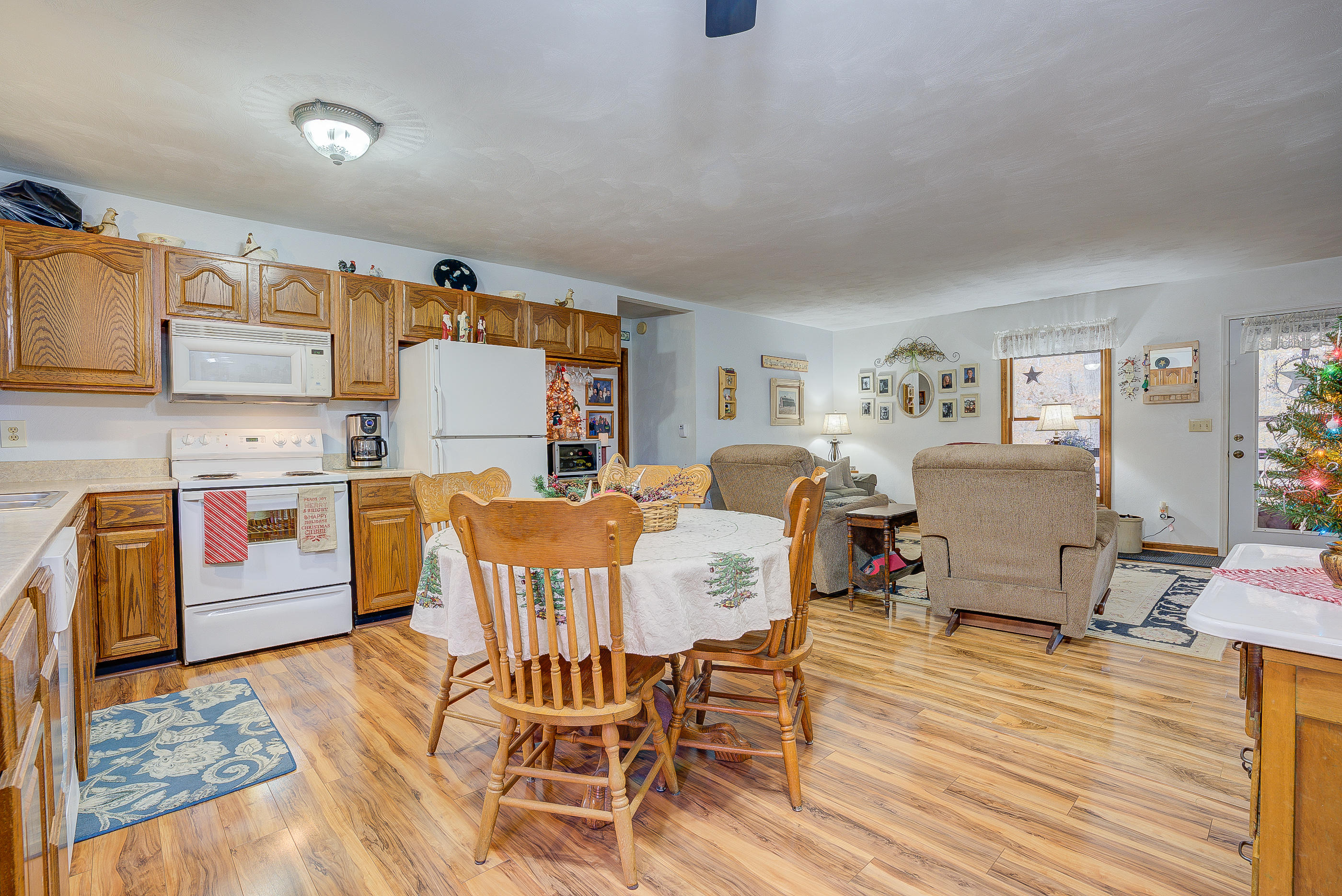 1037 Buck Mountain Road Goodview, VA 24095 - Photo 13 of 31 a living room with furniture and a wooden floor