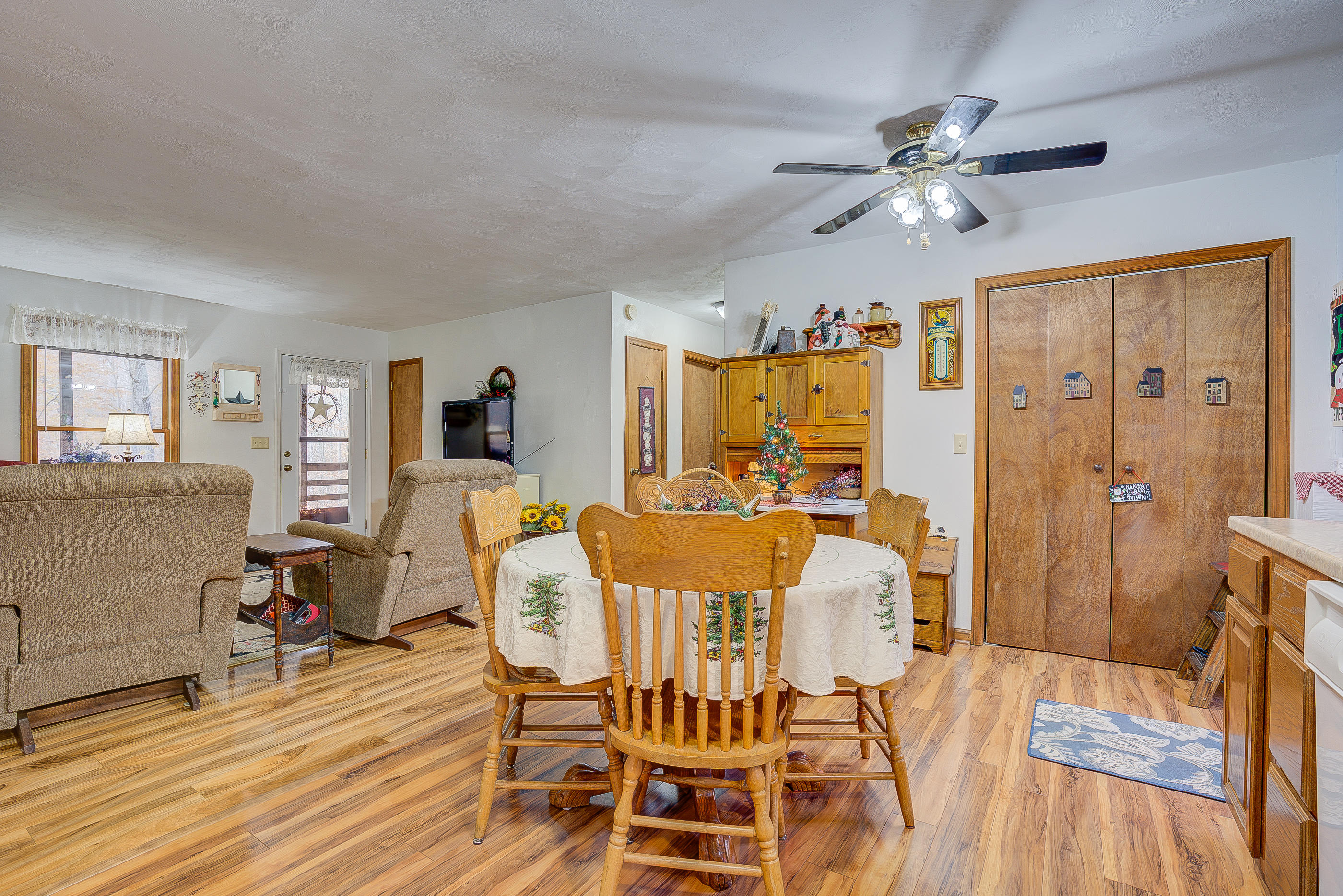 1037 Buck Mountain Road Goodview, VA 24095 - Photo 15 of 31 a view of a dining room with furniture and wooden floor