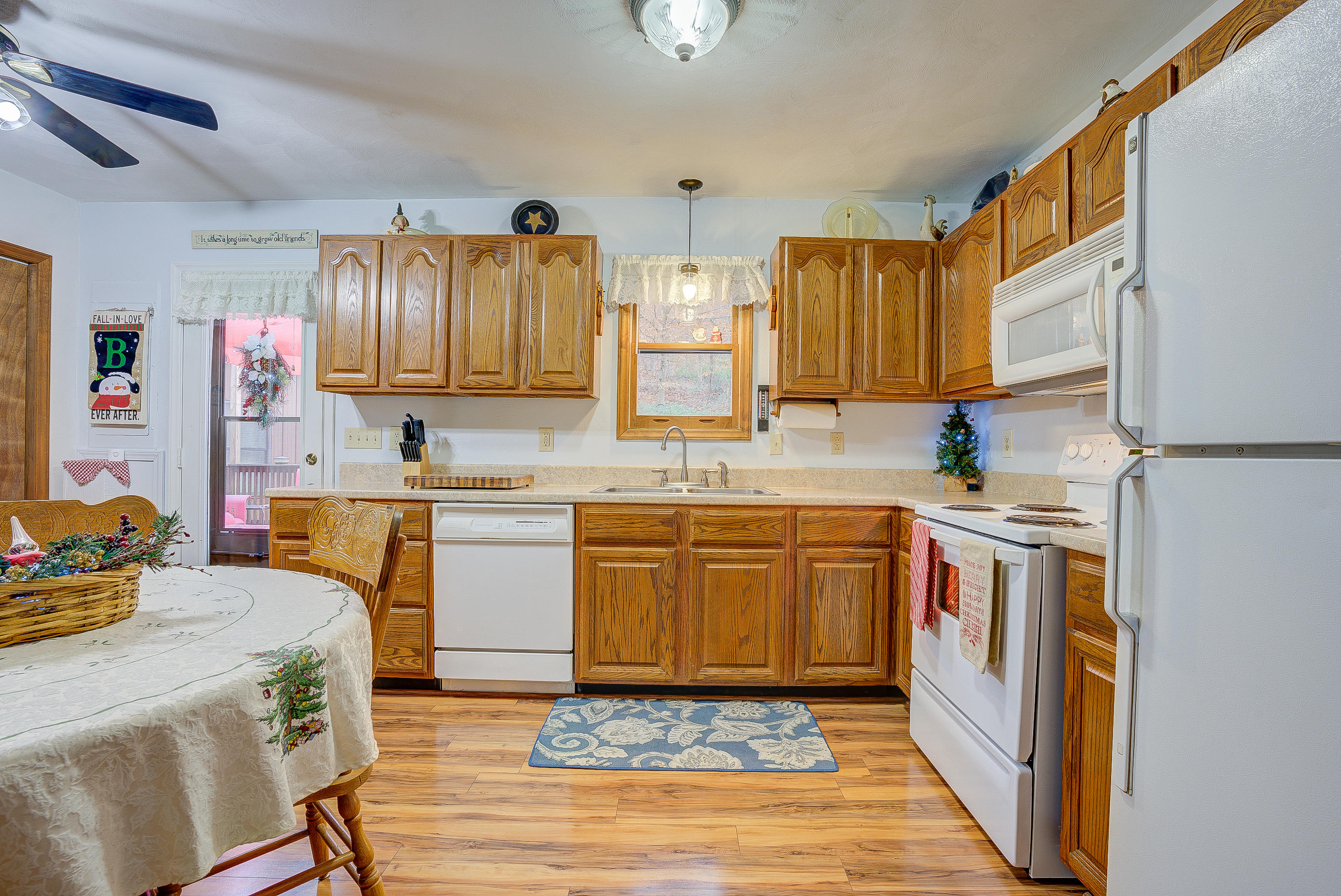 1037 Buck Mountain Road Goodview, VA 24095 - Photo 16 of 31 a kitchen with a sink stove and cabinets