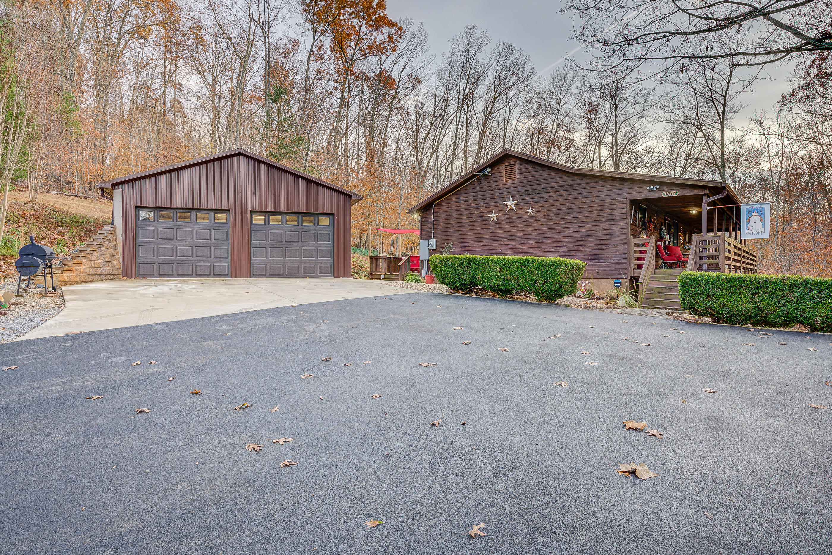 1037 Buck Mountain Road Goodview, VA 24095 - Photo 3 of 31 a front view of a house with a yard and garage