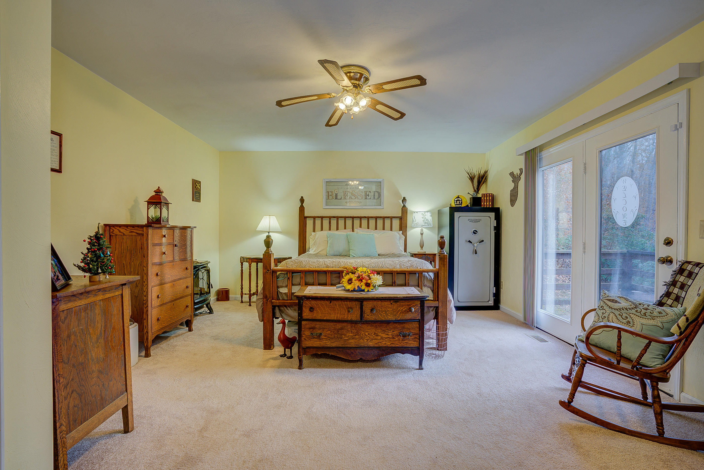 1037 Buck Mountain Road Goodview, VA 24095 - Photo 23 of 31 a bedroom with a bed and a chandelier