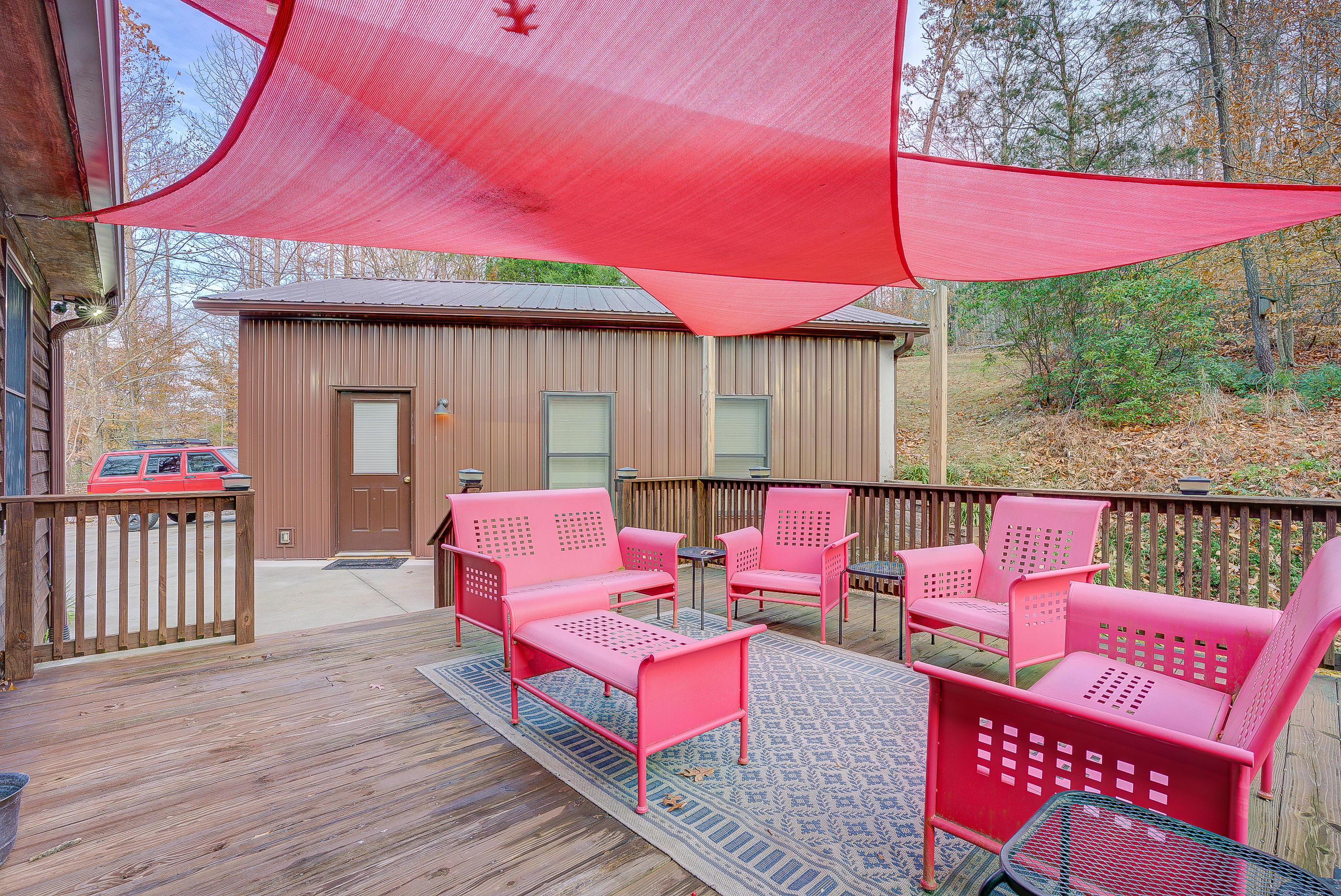 1037 Buck Mountain Road Goodview, VA 24095 - Photo 28 of 31 a patio with lawn chairs and wooden fence