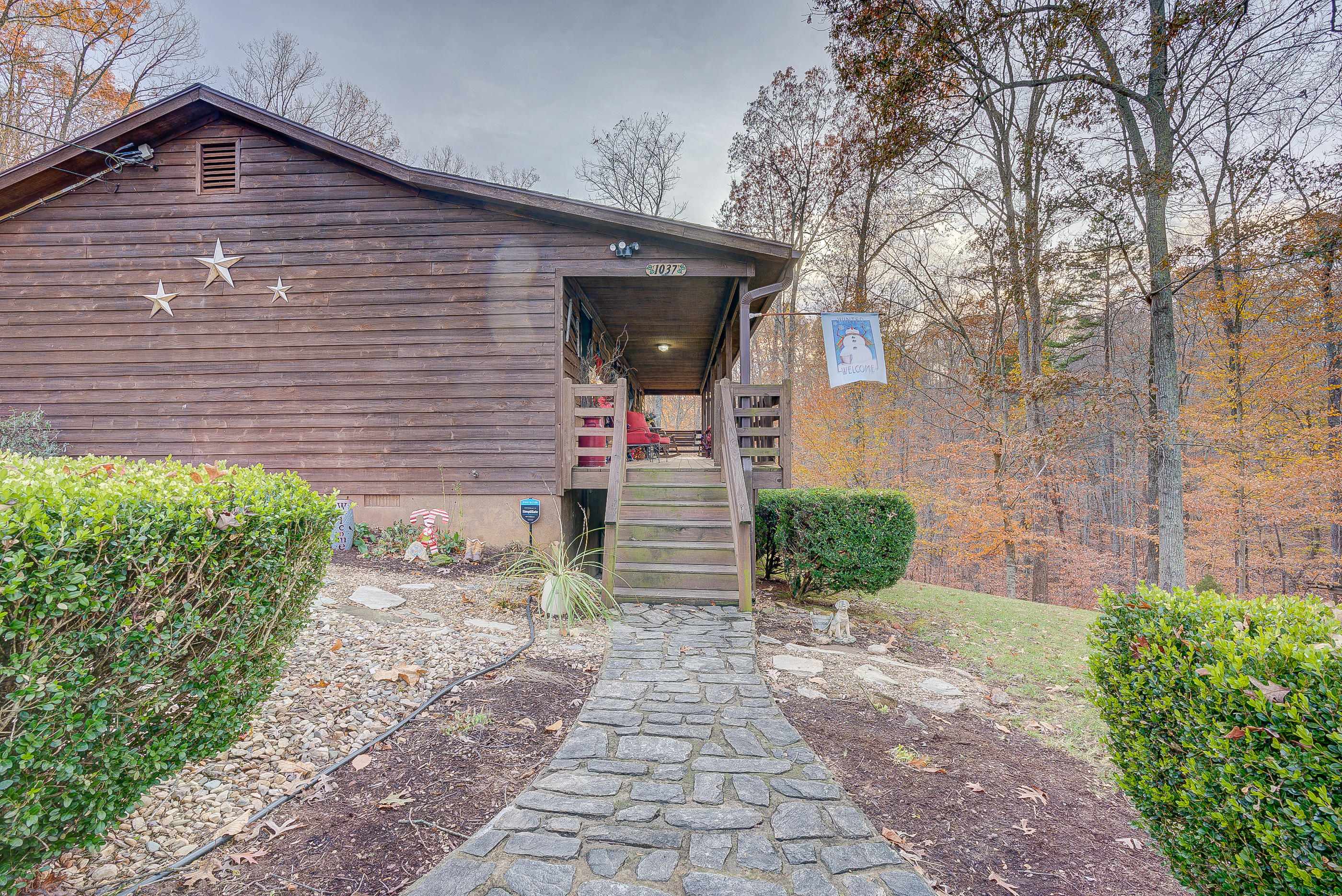 1037 Buck Mountain Road Goodview, VA 24095 - Photo 6 of 31 a front view of a house with garden