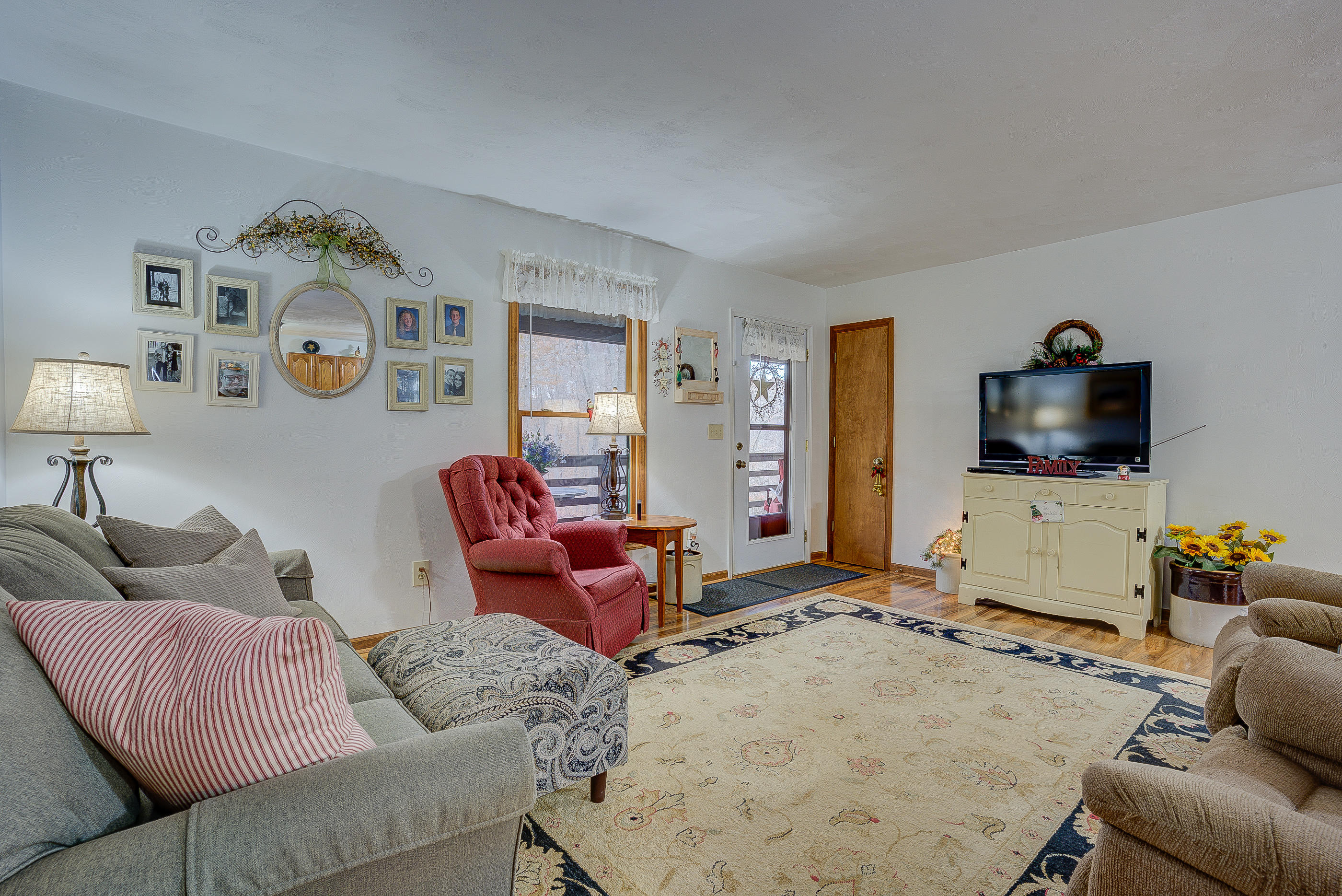 1037 Buck Mountain Road Goodview, VA 24095 - Photo 10 of 31 a living room with furniture and a flat screen tv