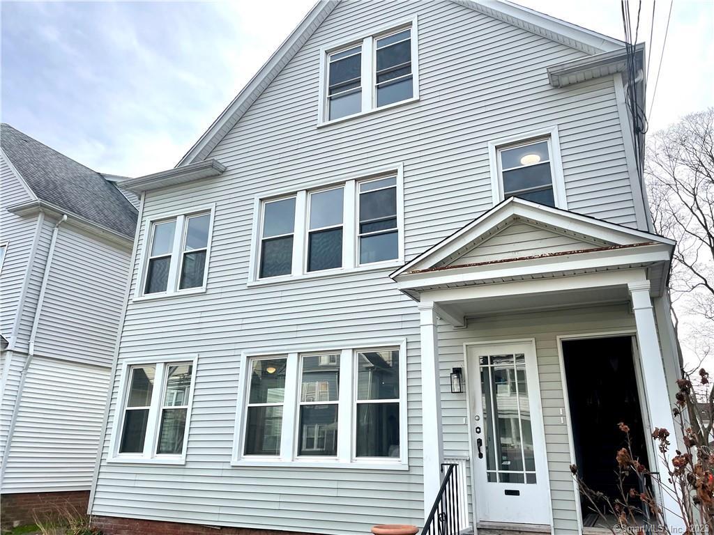 88 Beacon Street, Unit 3 Hamden, CT 06514 - Photo 1 of 1 a view of a house with more windows and brick walls