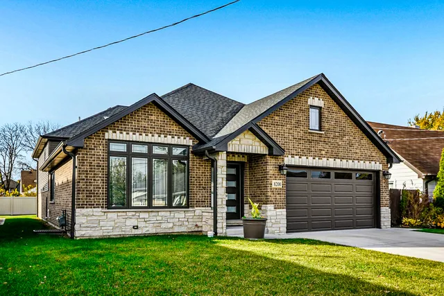 a view of a house with a yard and plants
