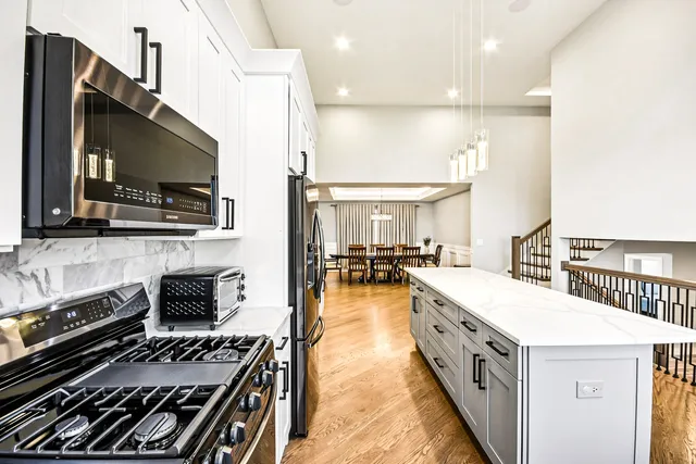 a kitchen with a stove and a microwave