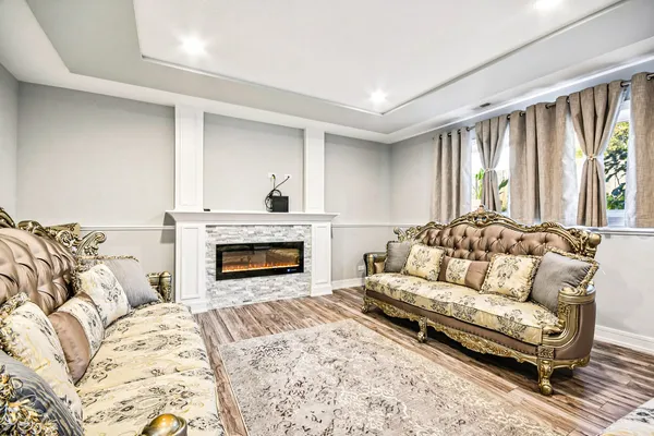 a living room with a couch and a fireplace