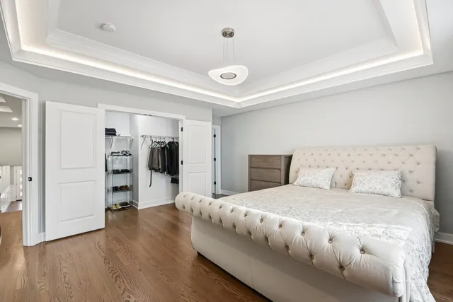 a bedroom with a large bed and a closet