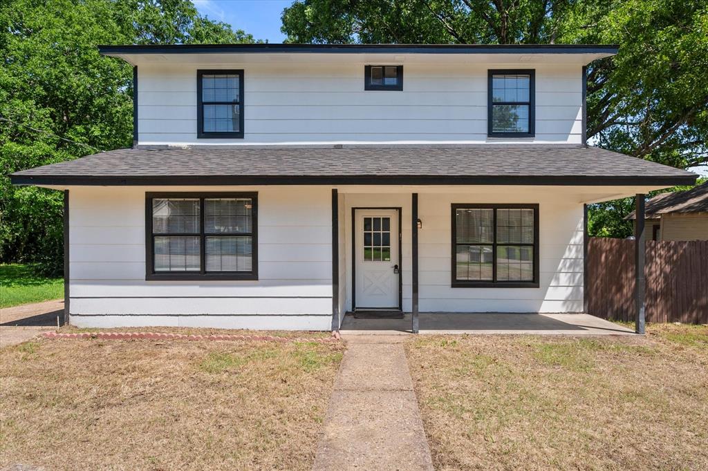 1312 East Collin Street Corsicana, TX 75110 - Photo 1 of 24 a front view of a house with a yard