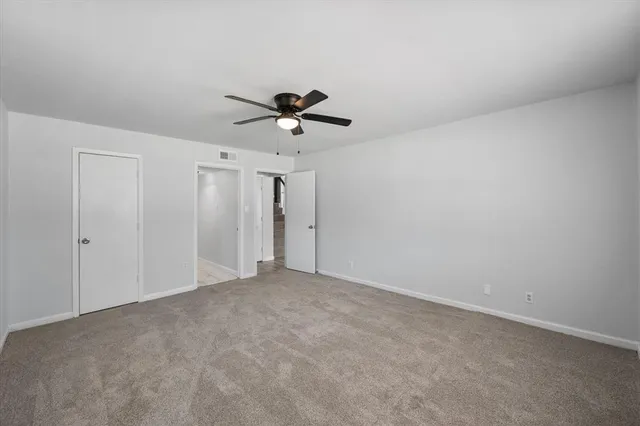 a view of a big room with carpet