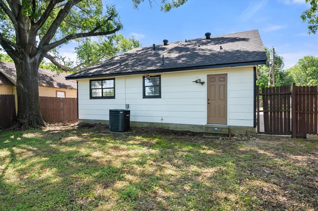 1312 East Collin Street Corsicana, TX 75110 - Photo 24 of 24 a house with trees in front of it