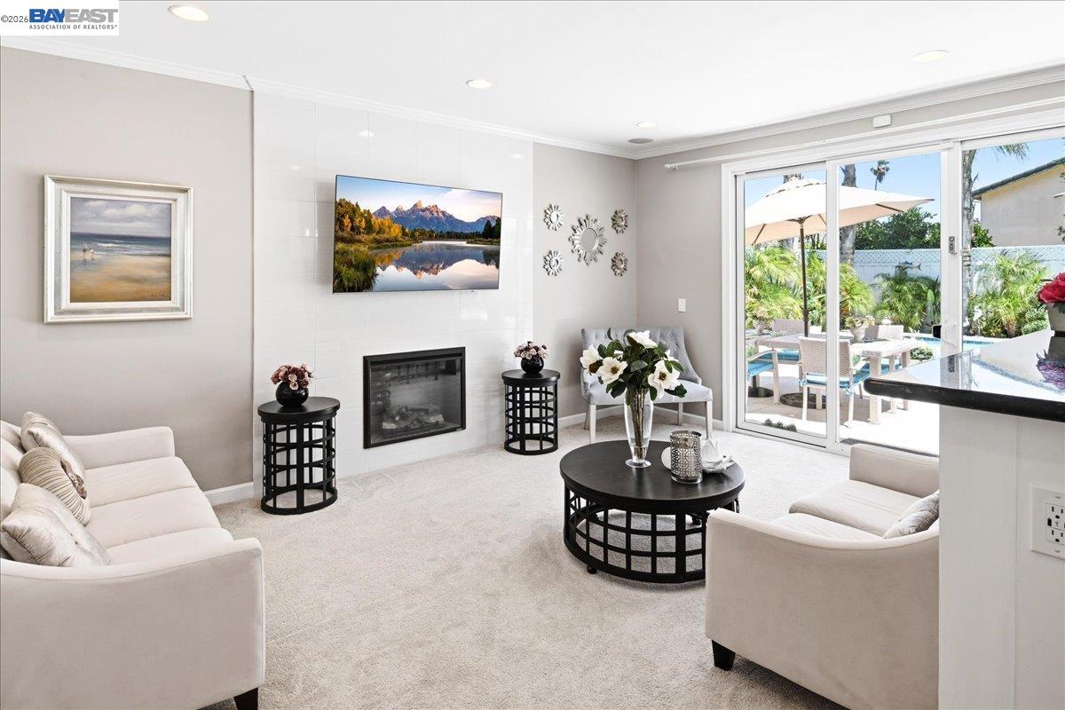 2861 Millbridge Place San Ramon, CA 94583 - Photo 25 of 58 a living room with furniture a fireplace and a flat screen tv