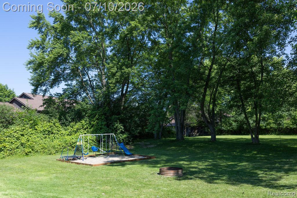 5052 Beecher Road Flint, MI 48532 - Photo 26 of 28 Expansive lawn featuring mature trees providing ample shade