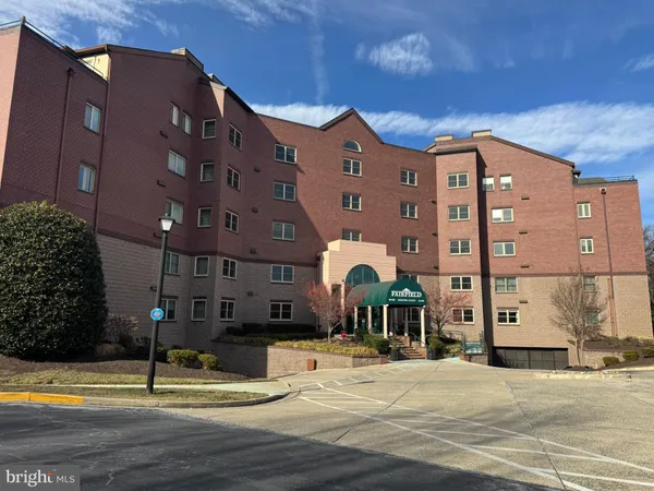 a front view of a building with street view