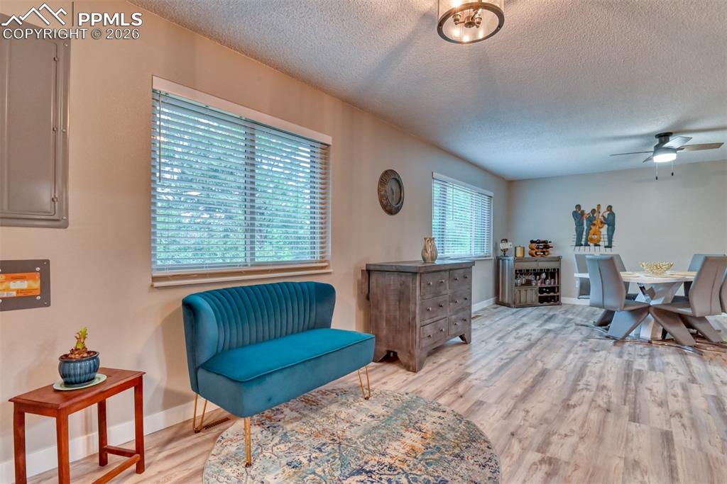 4506 Ridgecrest Drive Colorado Springs, CO 80918 - Photo 12 of 49 a living room with furniture and a wooden floor