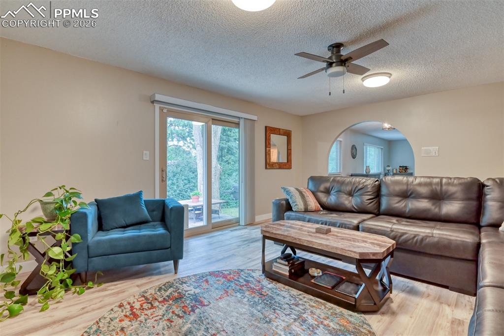 4506 Ridgecrest Drive Colorado Springs, CO 80918 - Photo 15 of 49 a living room with furniture and a wooden floor