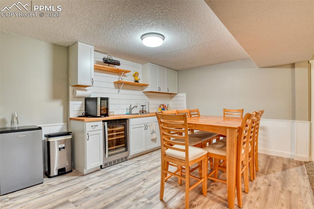 4506 Ridgecrest Drive Colorado Springs, CO 80918 - Photo 40 of 49 a kitchen with stainless steel appliances kitchen island granite countertop a sink and cabinets