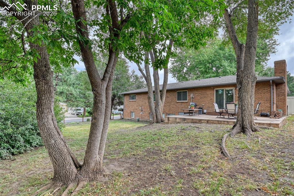 4506 Ridgecrest Drive Colorado Springs, CO 80918 - Photo 47 of 49 a view of a house with backyard from a patio