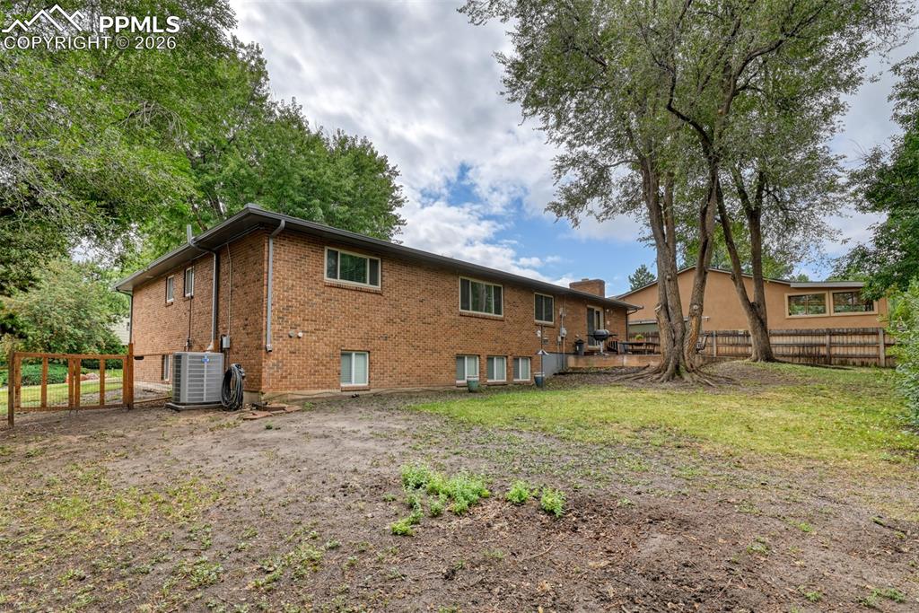 4506 Ridgecrest Drive Colorado Springs, CO 80918 - Photo 48 of 49 a view of a backyard with a large tree