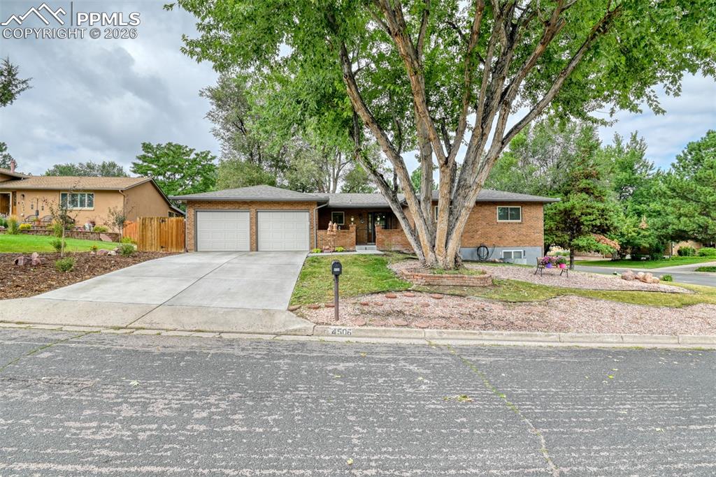 4506 Ridgecrest Drive Colorado Springs, CO 80918 - Photo 49 of 49 a house view with a garden space
