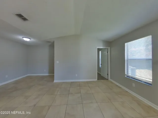 an empty room with windows