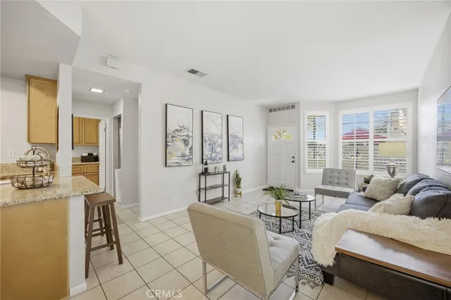 a living room with furniture and a table