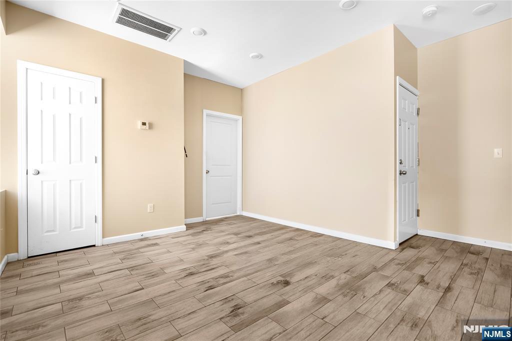183 Bergen Turnpike Ridgefield Park, NJ 07660 - Photo 10 of 18 a view of an empty room with wooden floor