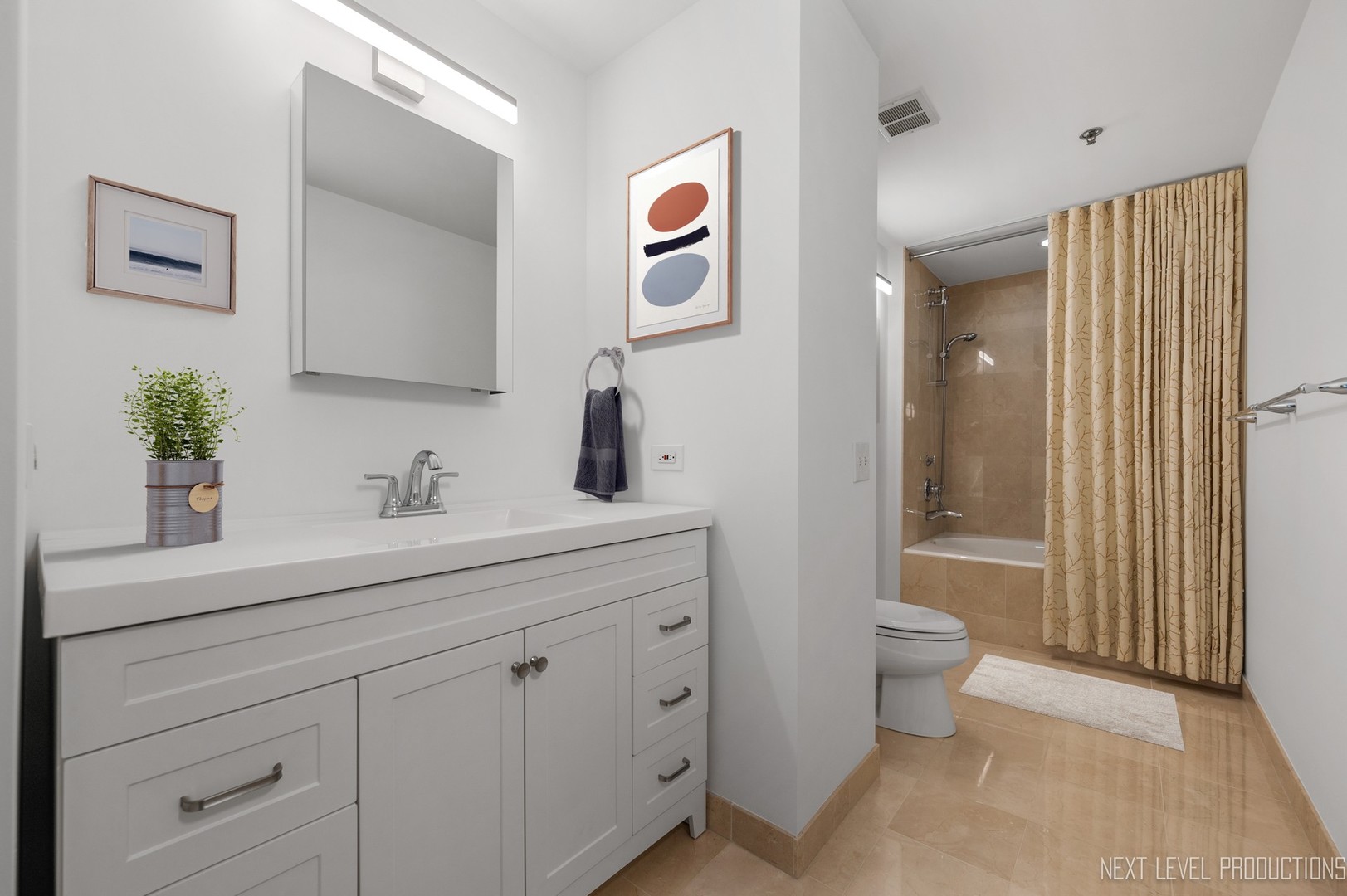 57 East Delaware Place, Unit 3203 Chicago, IL 60611 - Photo 14 of 27 a bathroom with a sink a toilet and shower