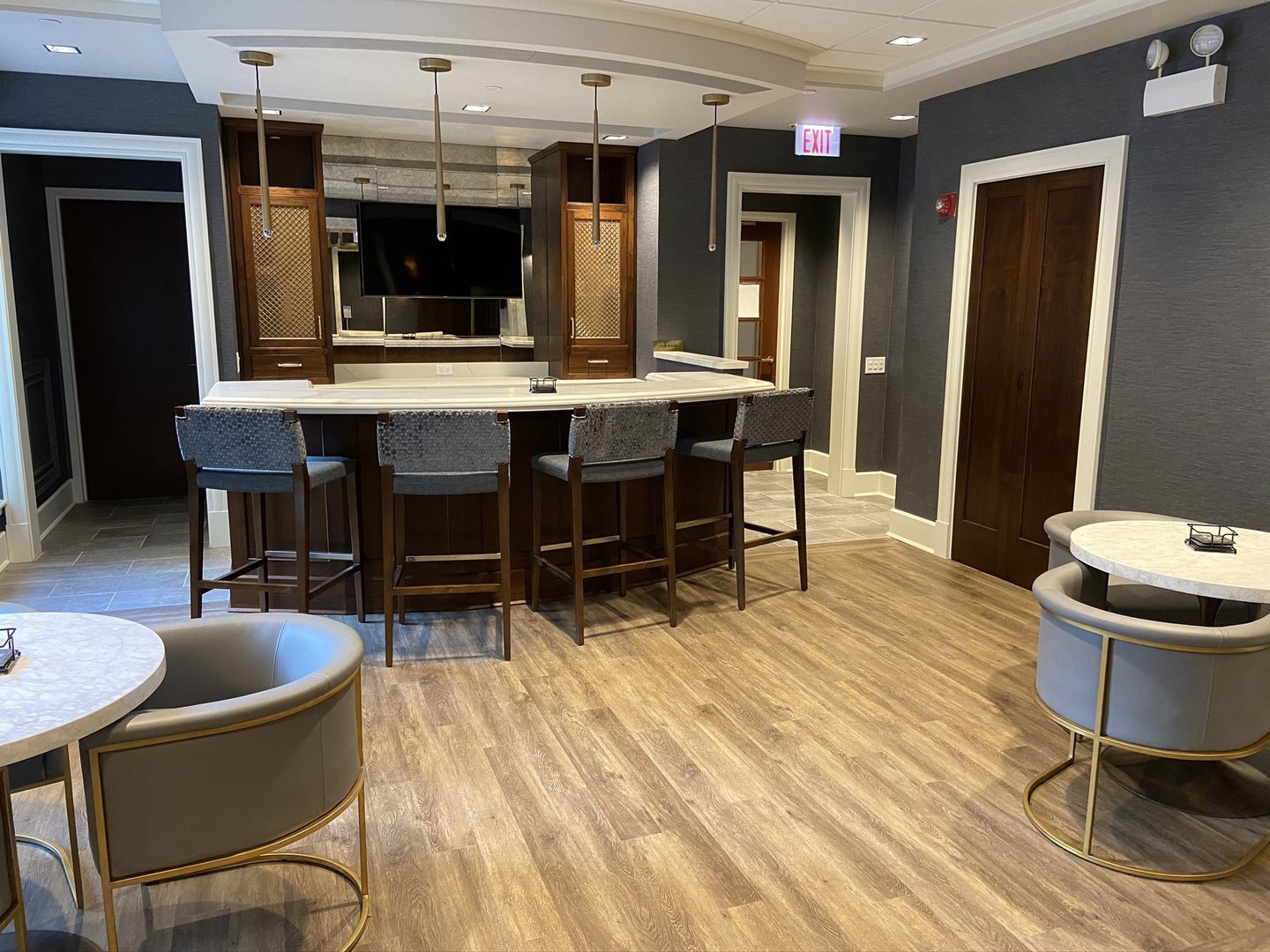 57 East Delaware Place, Unit 3203 Chicago, IL 60611 - Photo 20 of 27 a living room with furniture a flat screen tv and kitchen view