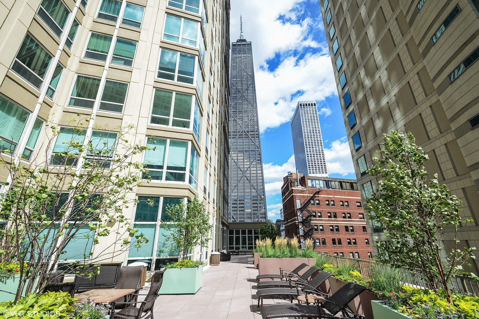 57 East Delaware Place, Unit 3203 Chicago, IL 60611 - Photo 27 of 27 a front view of a multi story building with a yard