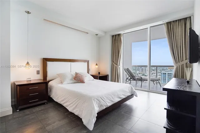 a bedroom with a bed and a desk