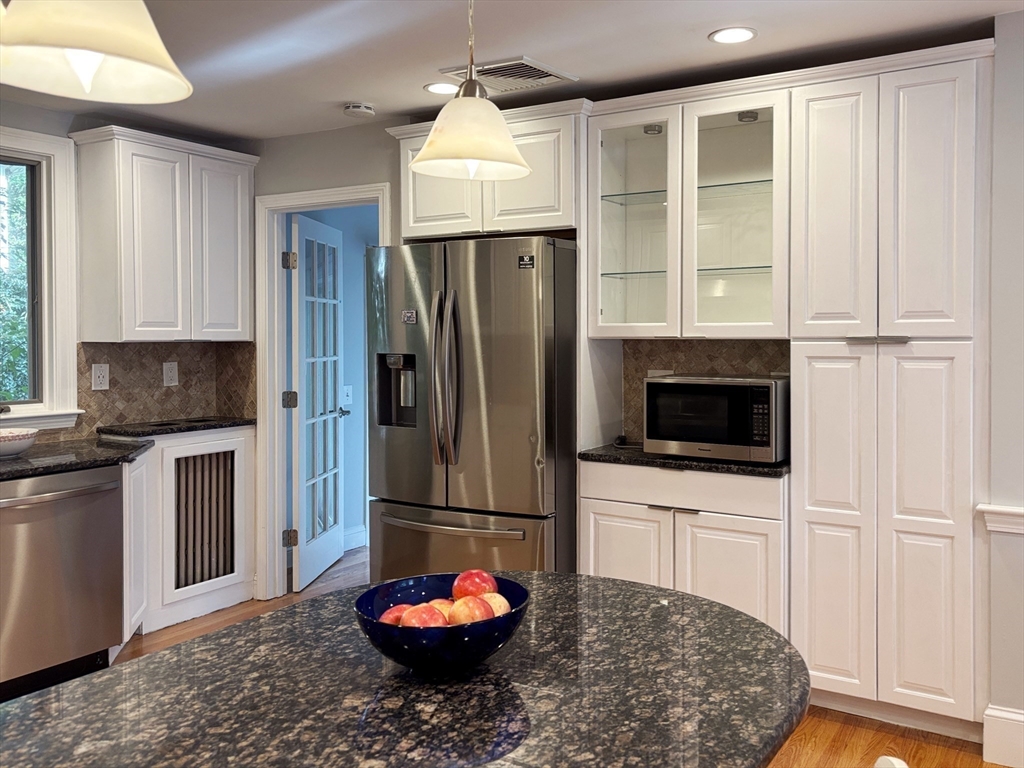 50 Dwhinda Road Newton, MA 02468 - Photo 12 of 42 a kitchen with stainless steel appliances granite countertop a refrigerator sink and microwave